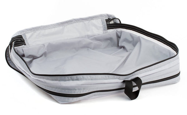 An empty and open Northwest Sky (light grey) Aether Large Aeronaut 45 Packing Cube mesh side up.